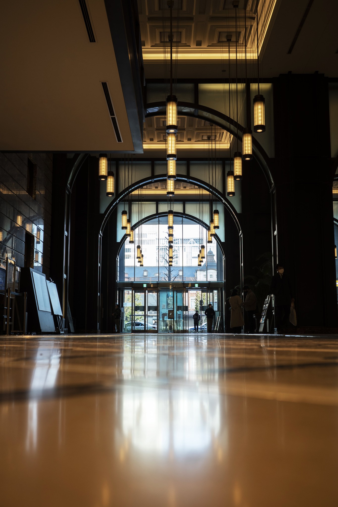 A luxury boutique hotel lobby with modern lighting and architecture